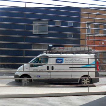 an HVP van seen through a garage door opening